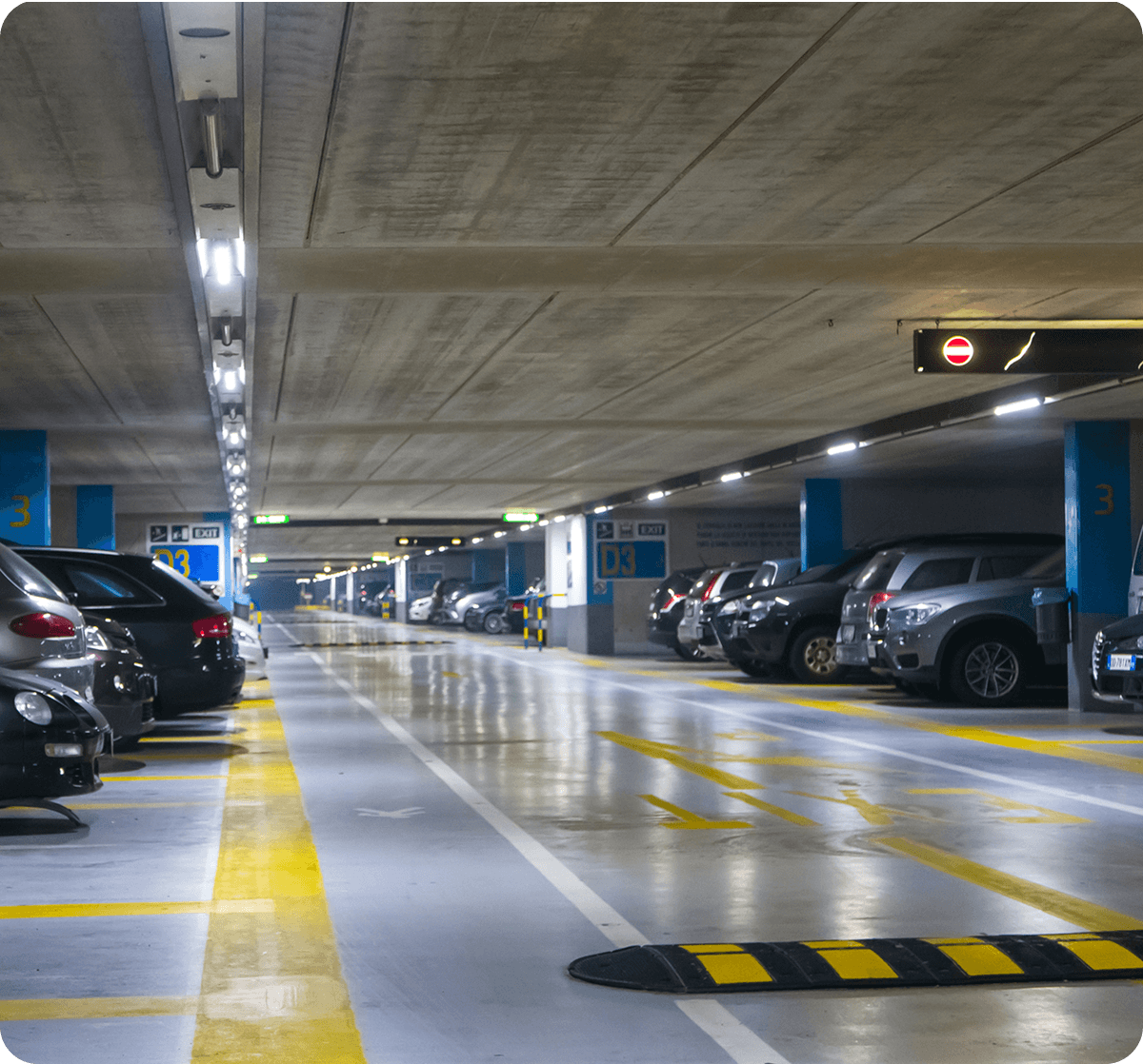 Underground parking garage with parked cars