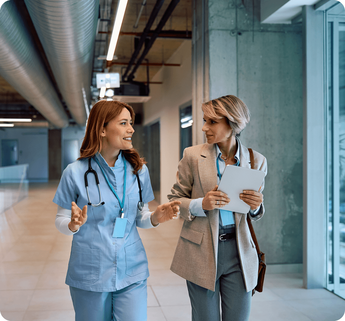 Healthcare professionals discussing in a hallway