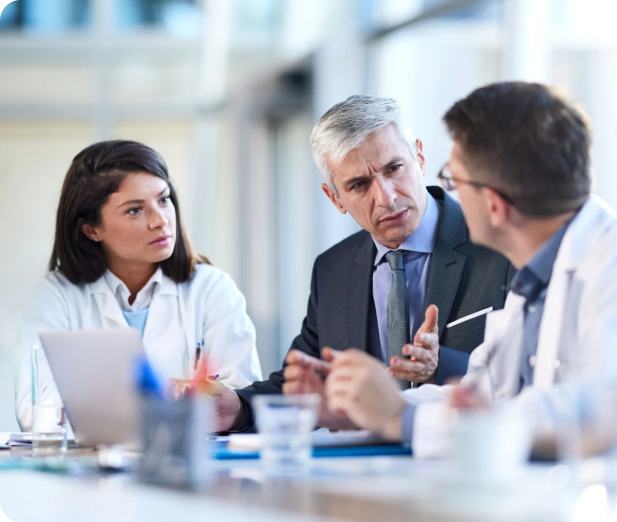 Medical team discussing with businessman