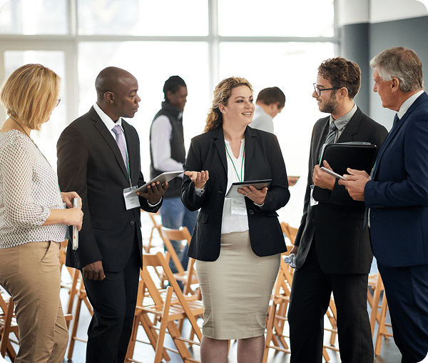 Team conversing with digital tablets